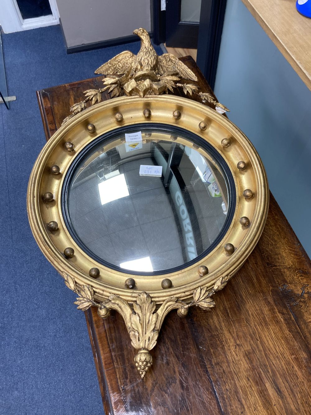 A Regency style giltwood convex mirror, diameter 50cm